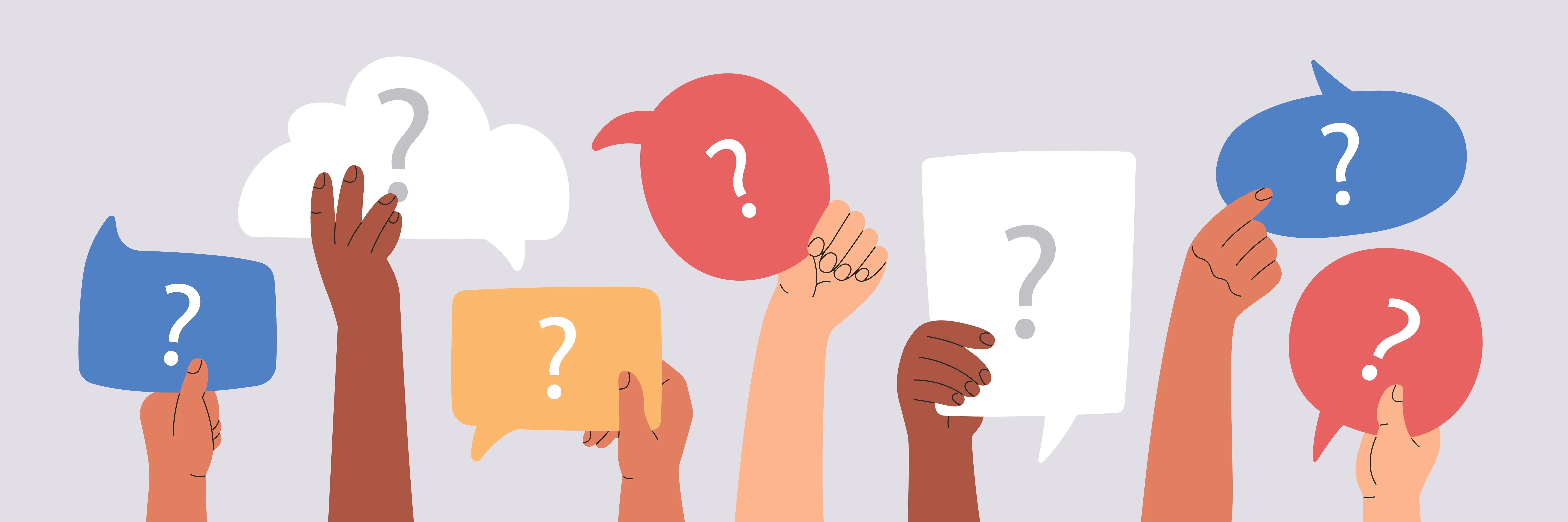 Hands holding question mark signs