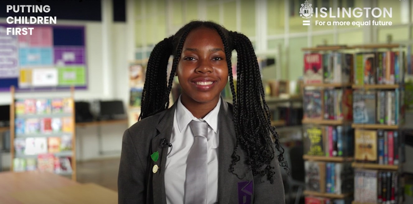 Putting Children First - screen shot of video showing young girl smiling at the camera
