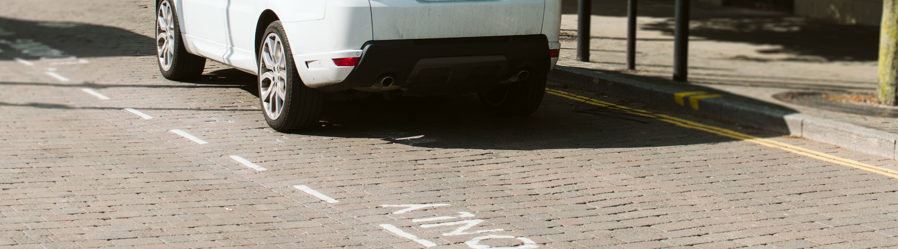 Photo of car parked in parking bay.