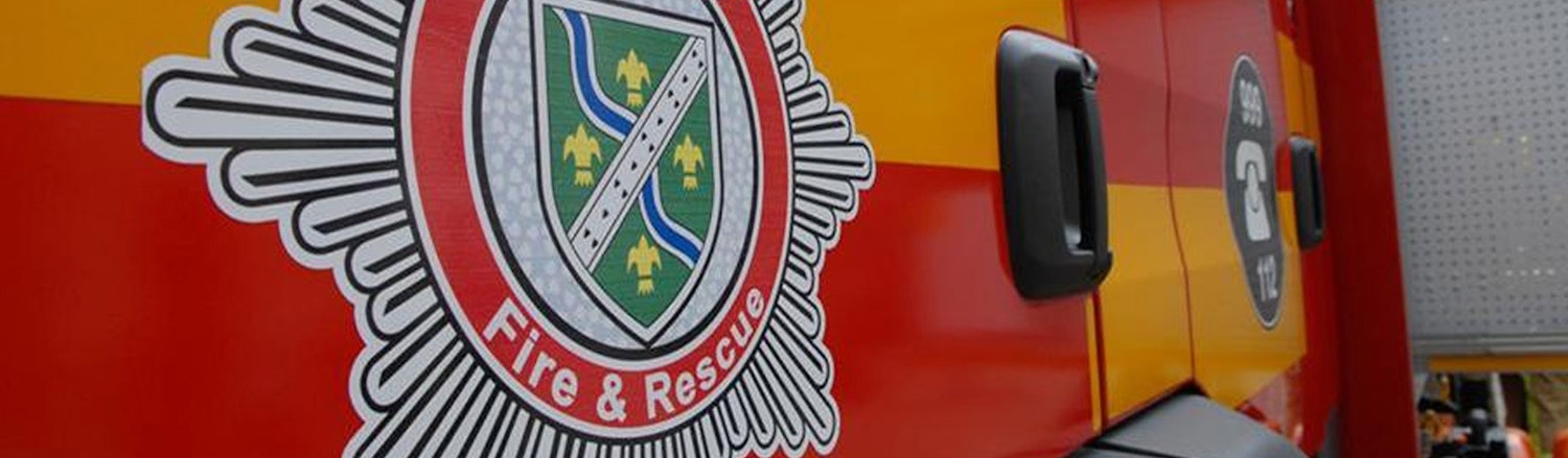Photograph of a fire engine displaying a Fire and Rescue crest