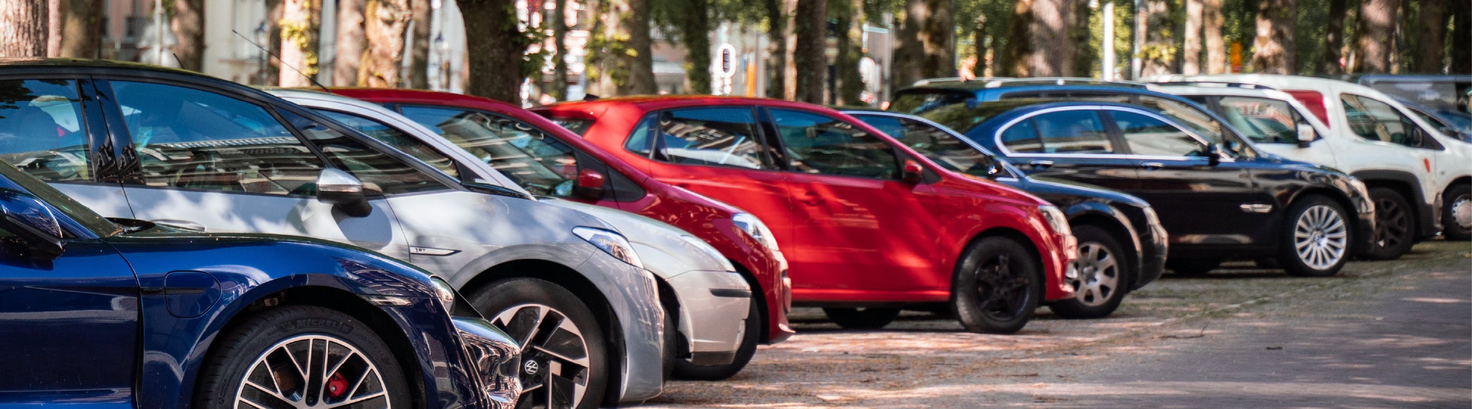 Photo of row of parked cars.