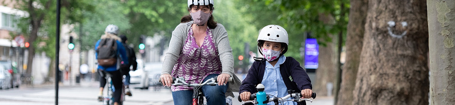 Image of a woman and child cycling