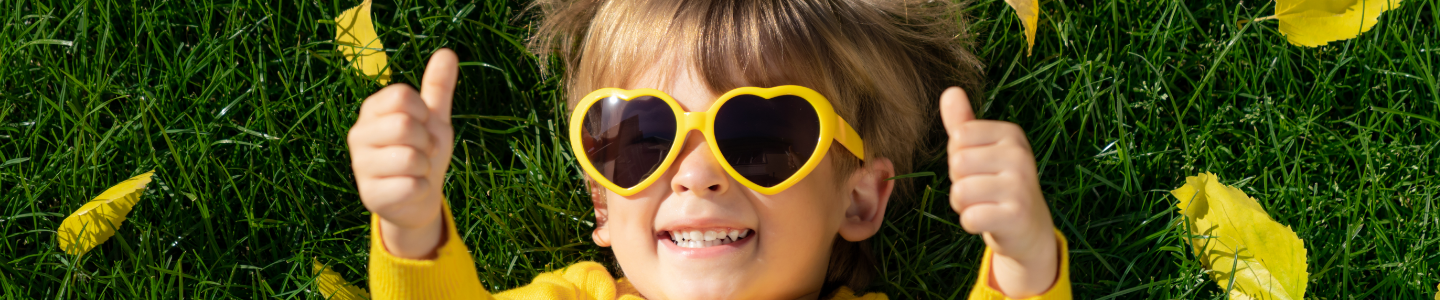 Child with thumbs up