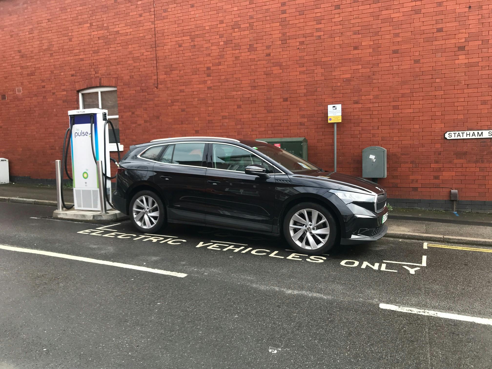 Photograph of a private car using the on-street charge point at Statham Street