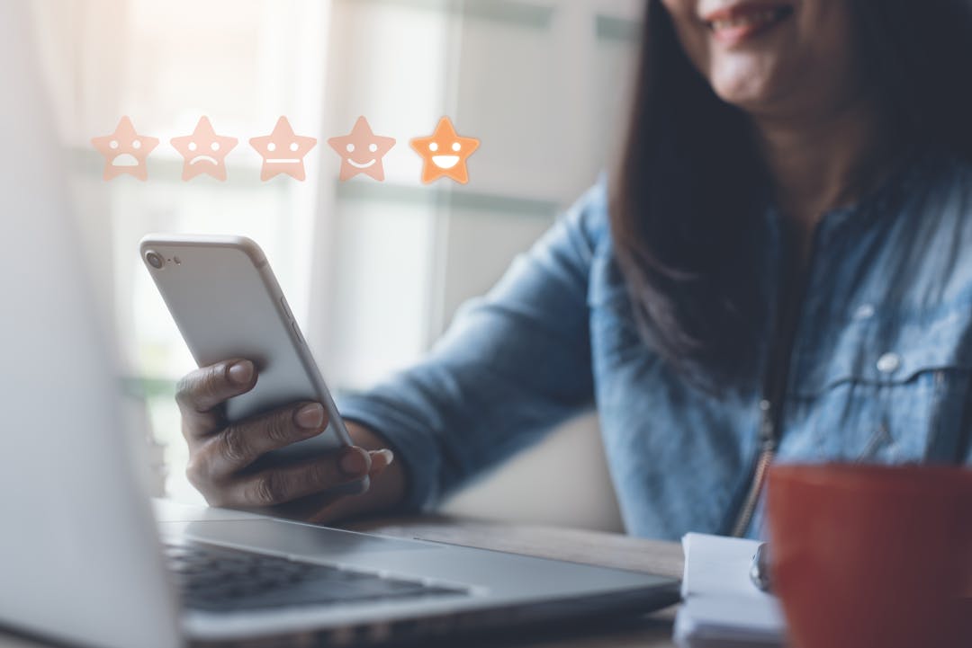 A woman using a mobile phone to give feedback