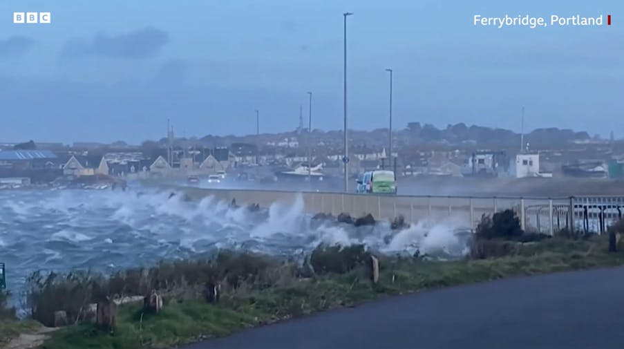 Waves overtopping the Ferrybridge section of the A354, Portland, during storm Eunice on 18th February 2022 