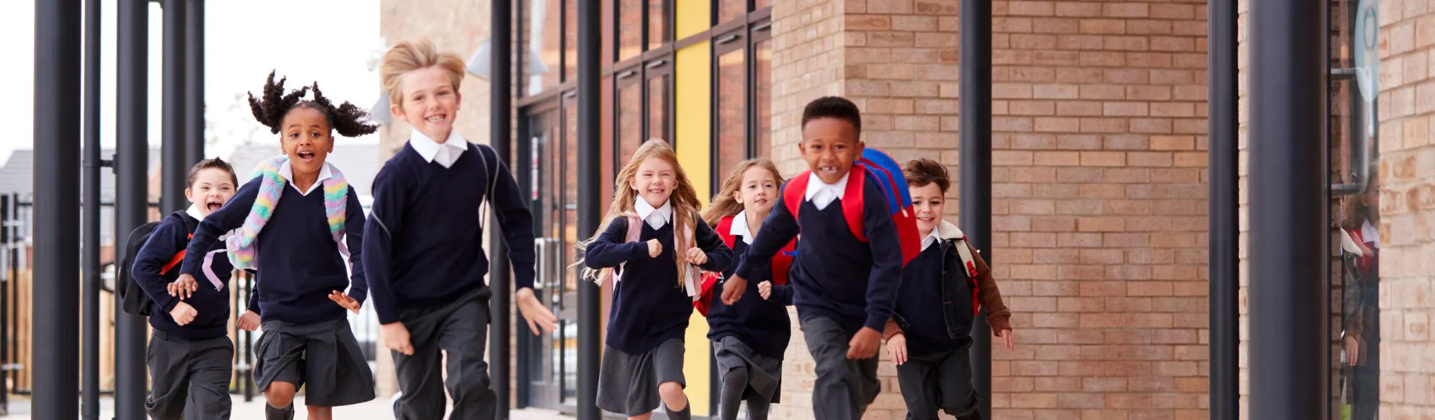 Group of students running in a playground.