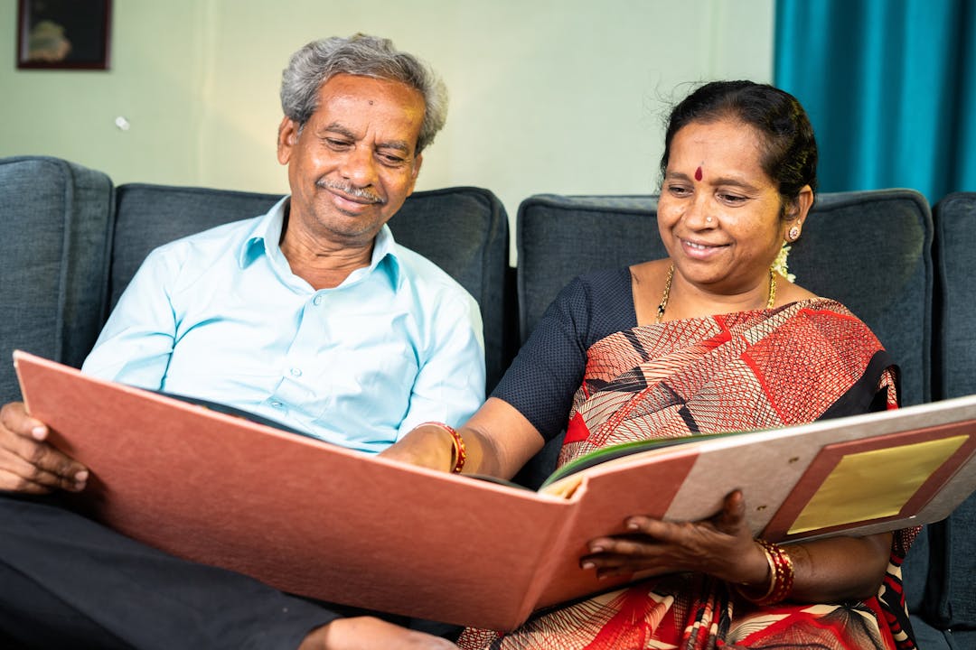 Asian couple looking over memories a scrap book