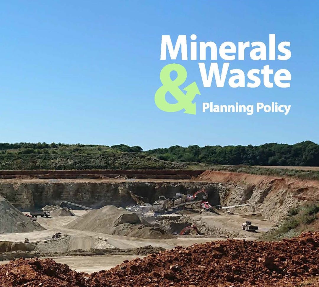 Quarry with the writing Minerals & Waste Planning Policy