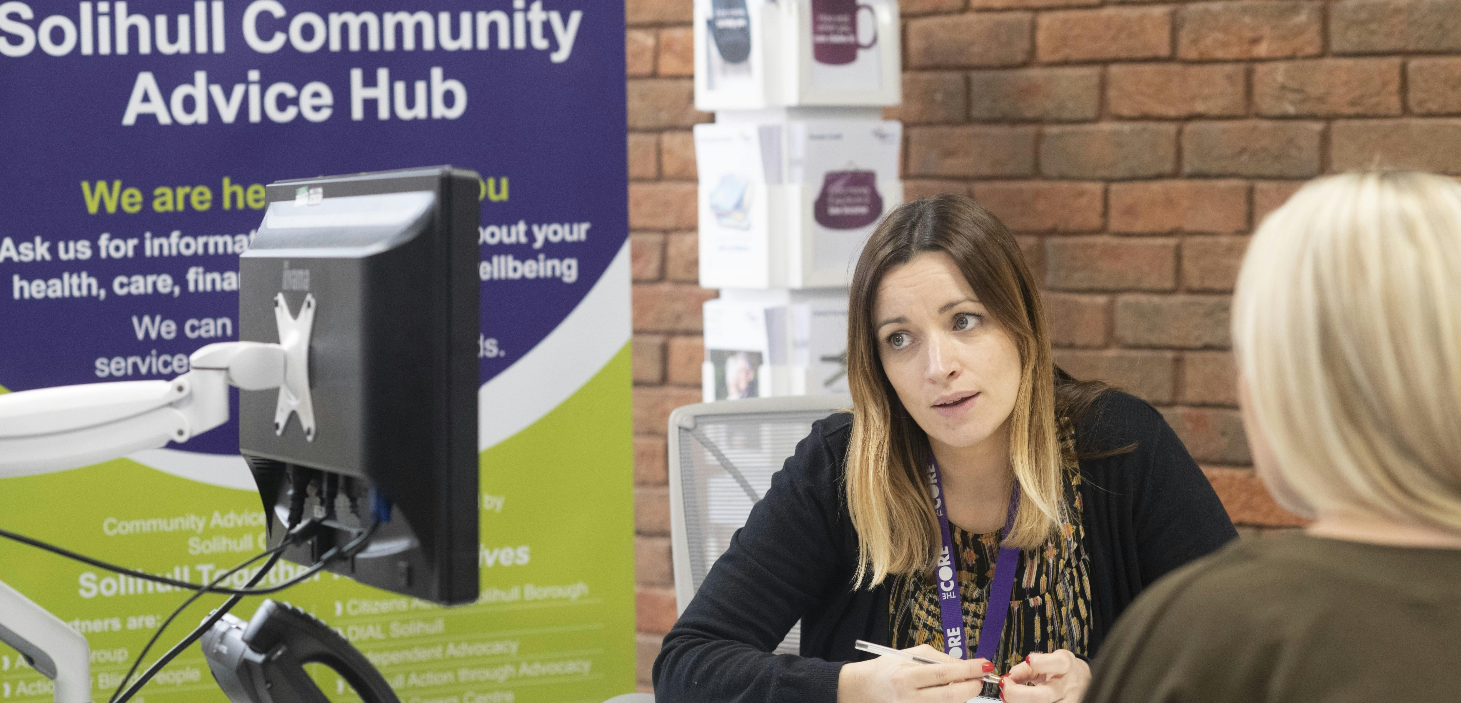 Community Advice Hub worker talking to member of public