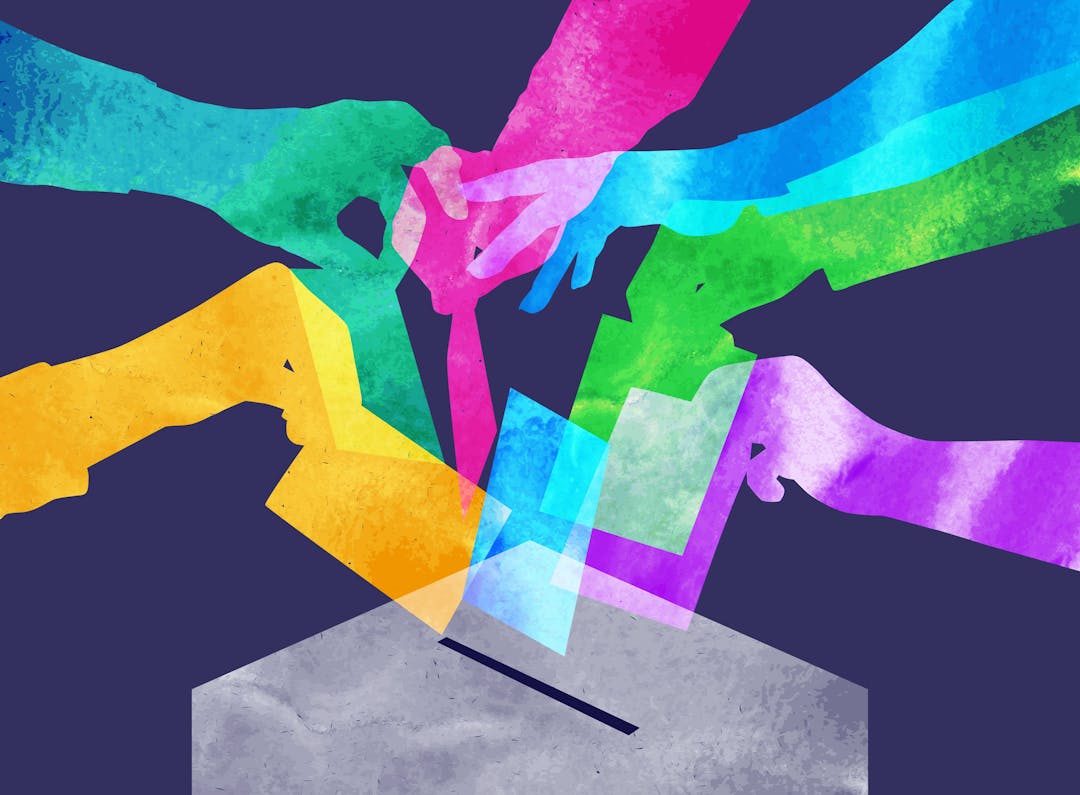 Image of brightly coloured hands posting ballot papers in to a ballot box