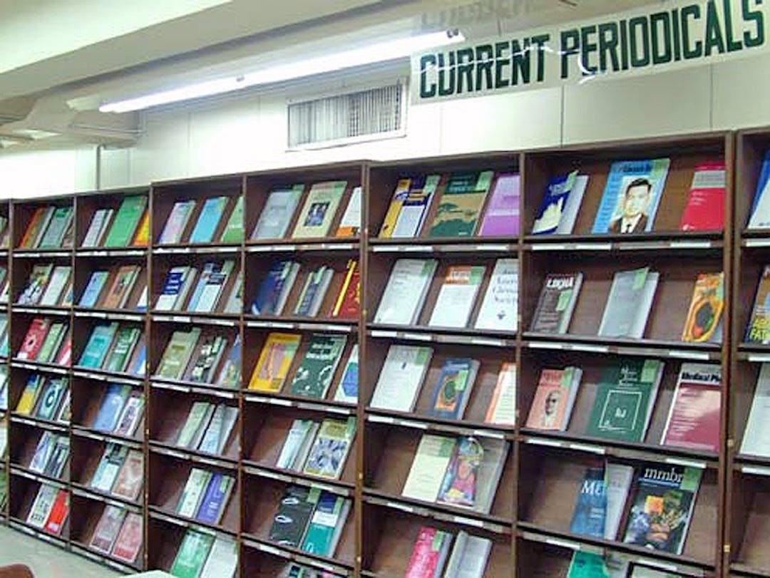 Periodicals on a library bookshelf display