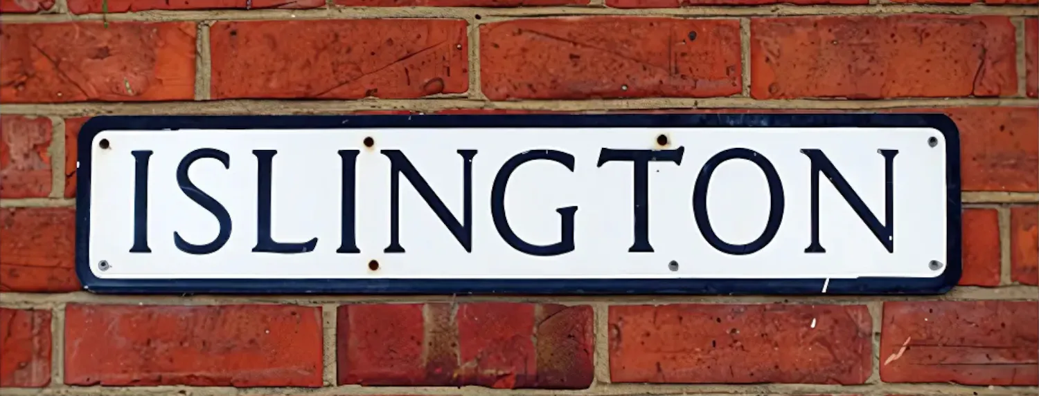 Islington street sign on a red brick wall.