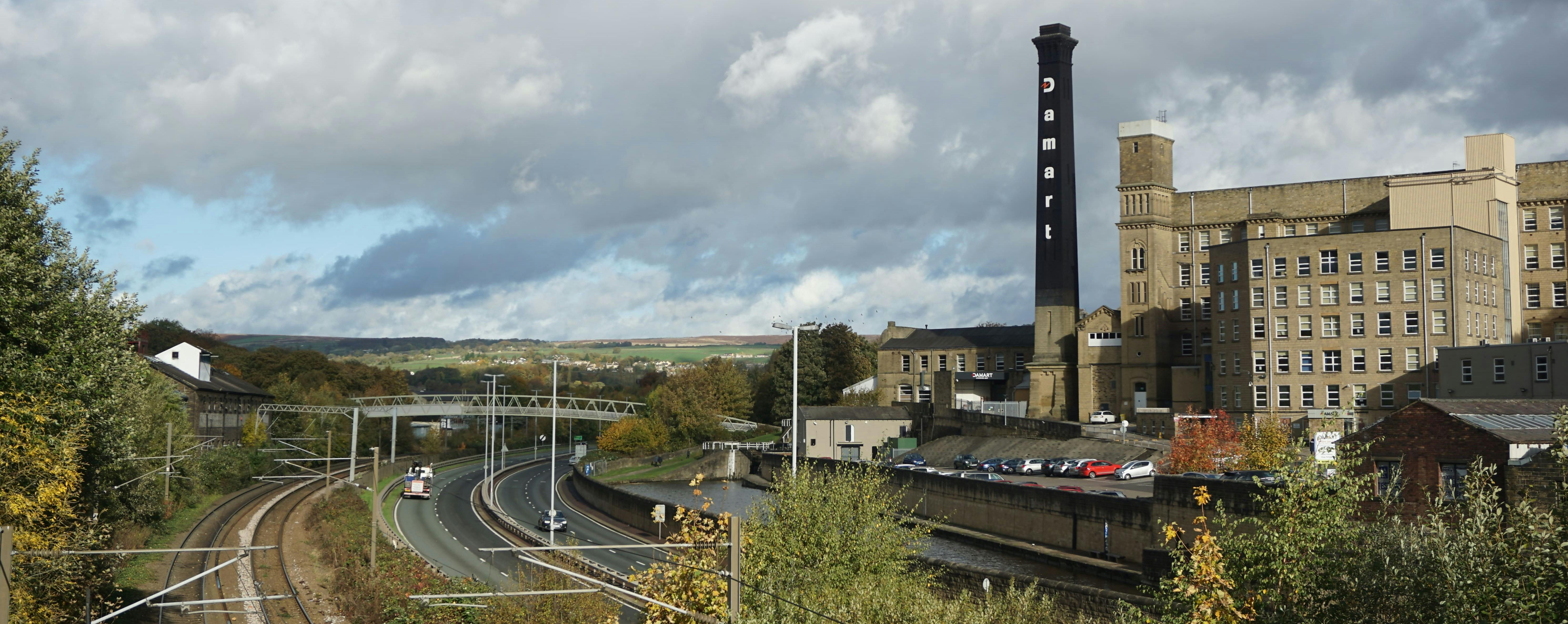 View of the railway, road and canal at Bingley
