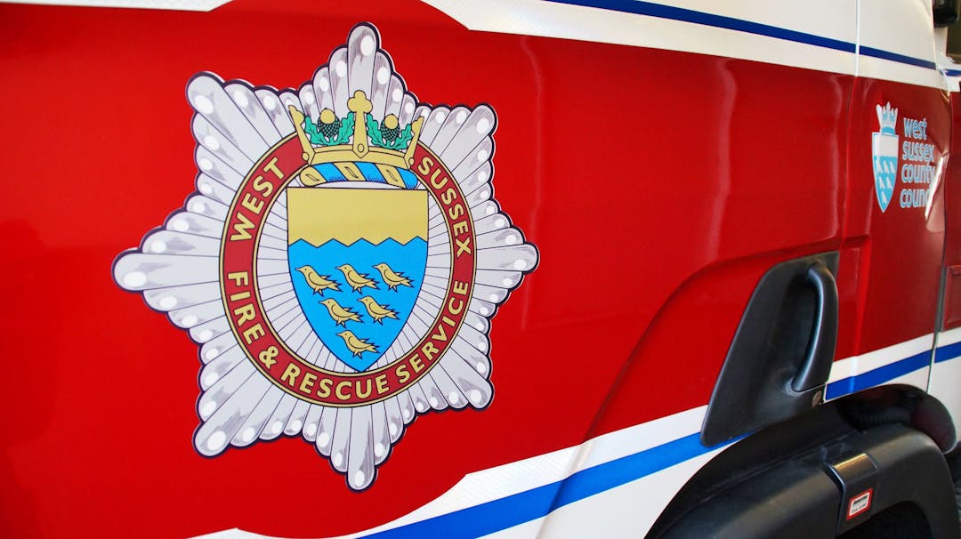 West Sussex Fire and Rescue logo shown on the side of a fire engine