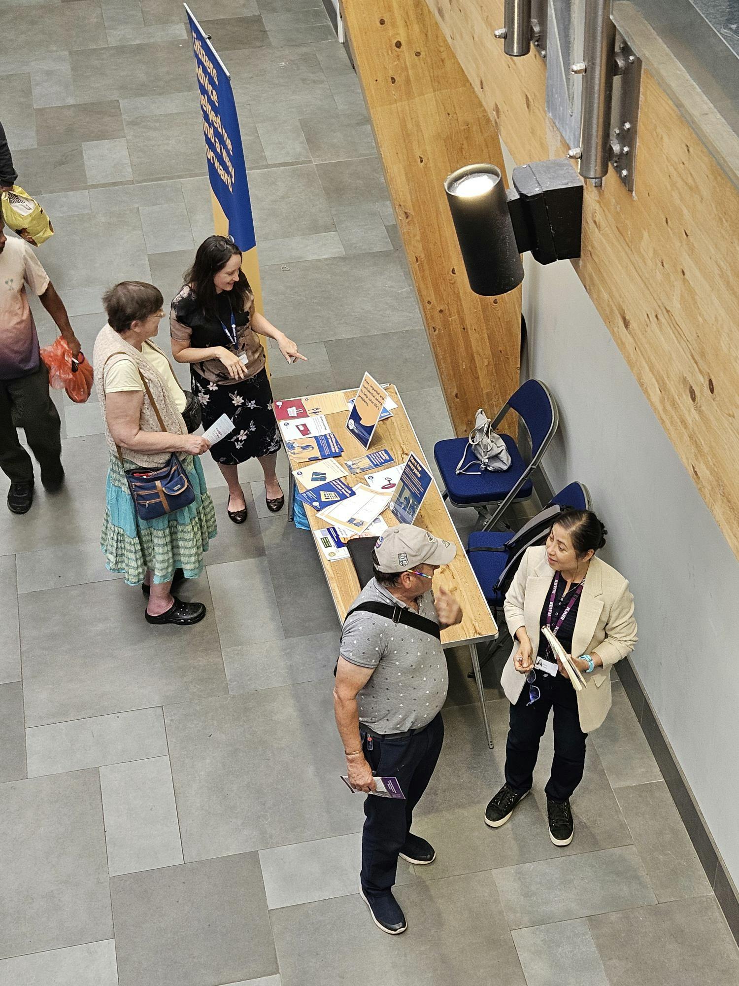 Residents speak to staff about the types of support that are available to unpaid carers.