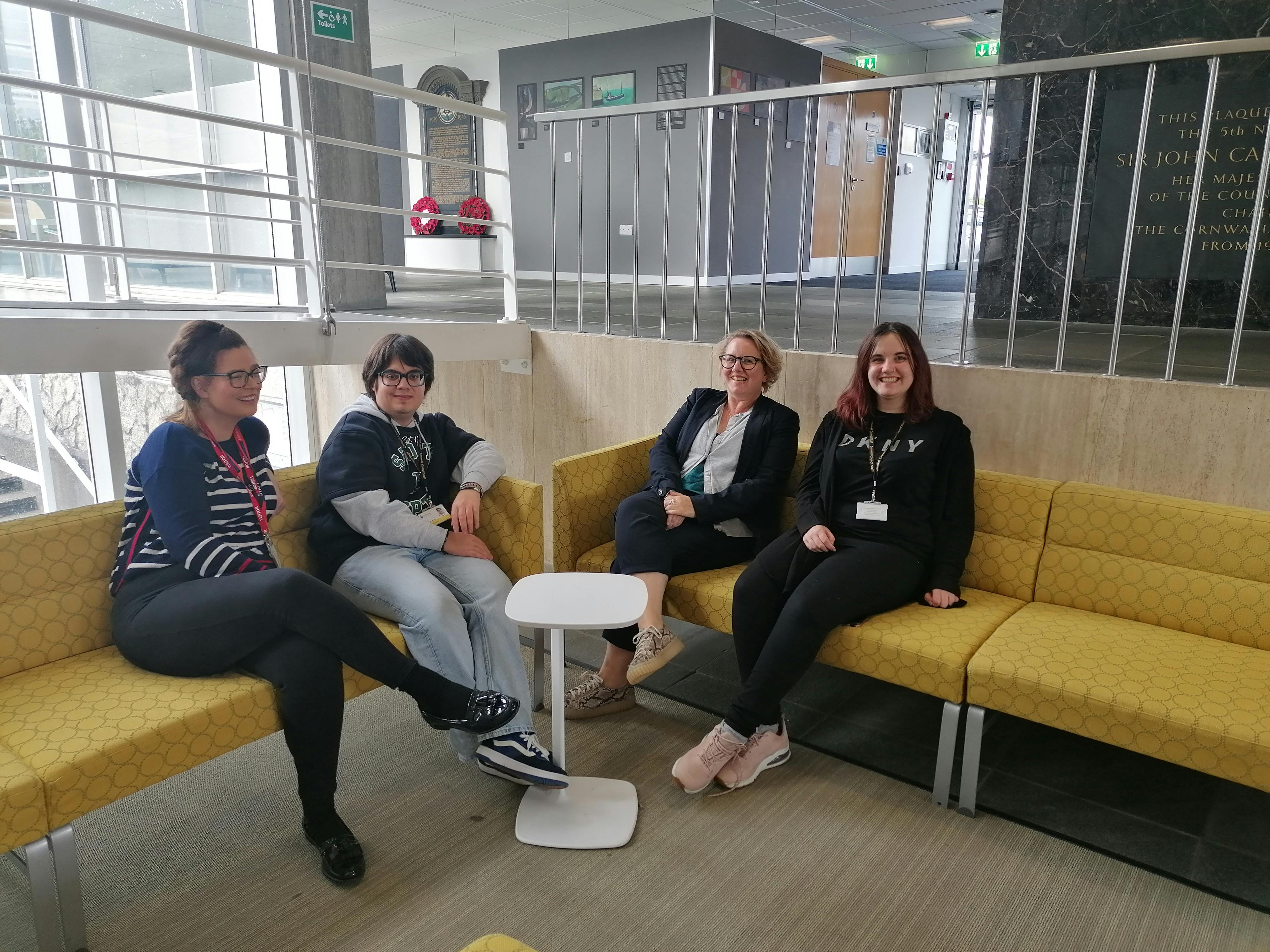 Supported interns in a meeting.