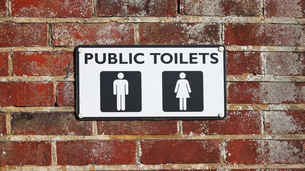 Public toilets sign