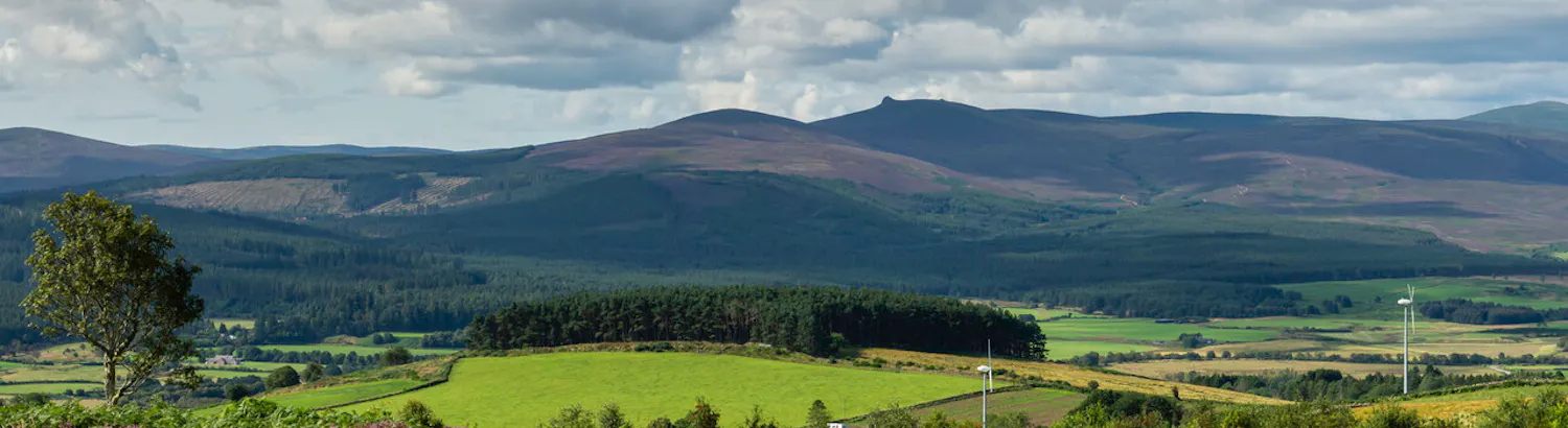 View across Aberdeenshire landscape with hills in the distance