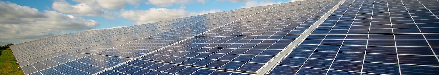 Row of solar panels in a field