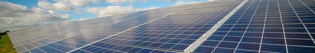 Row of solar panels in a field