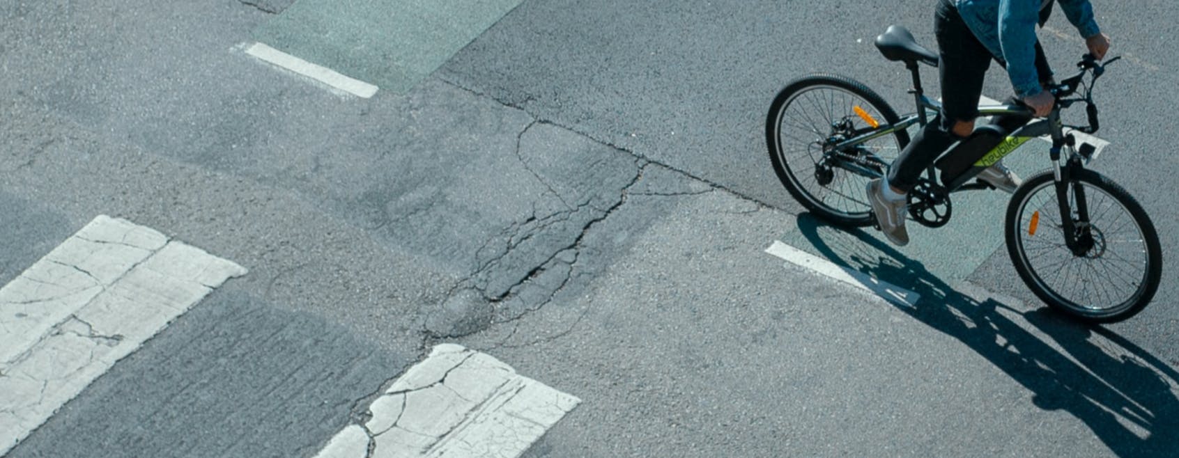 Photo of parallel crossing with cyclist riding pedal cycle.
