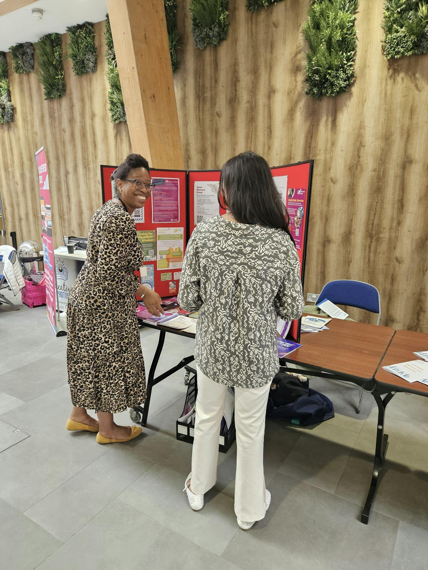A resident finding out about the support available through the Family Hubs.