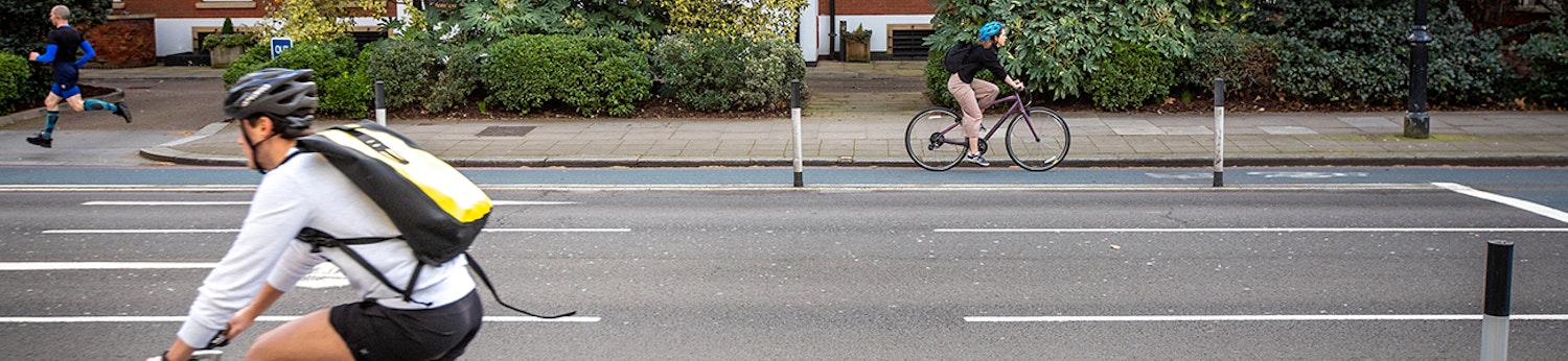 Two people cycling on a temporary cycle lane