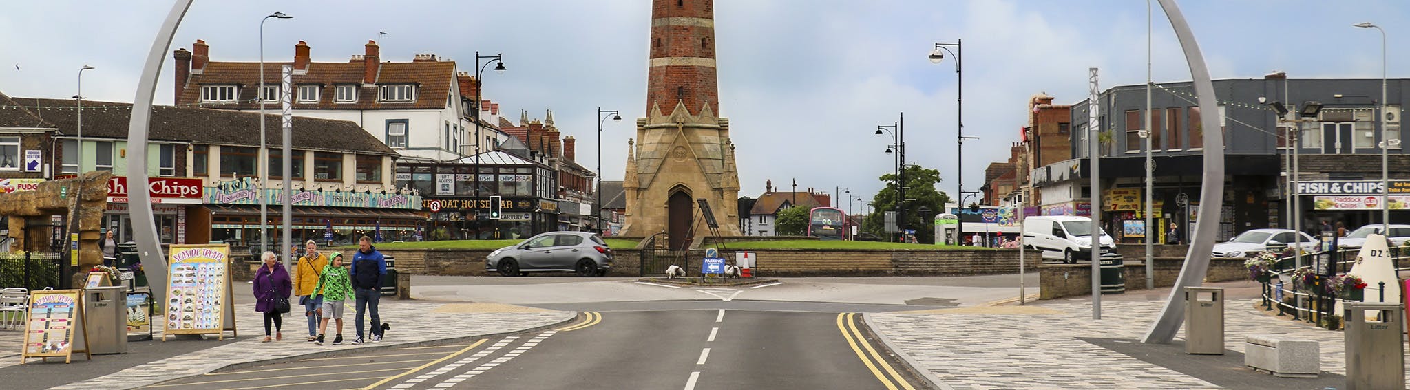 Street scene in the centre of Skegness with the clock tower, cars and people