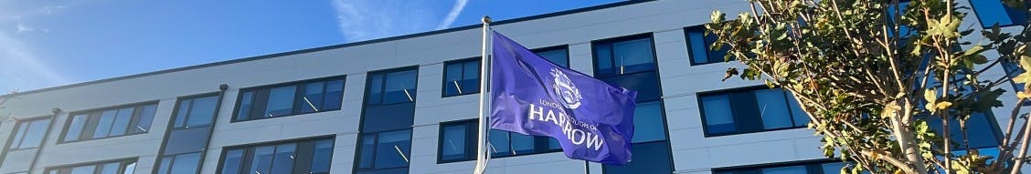 Exterior of Harrow Council Hub with corporate flag flying