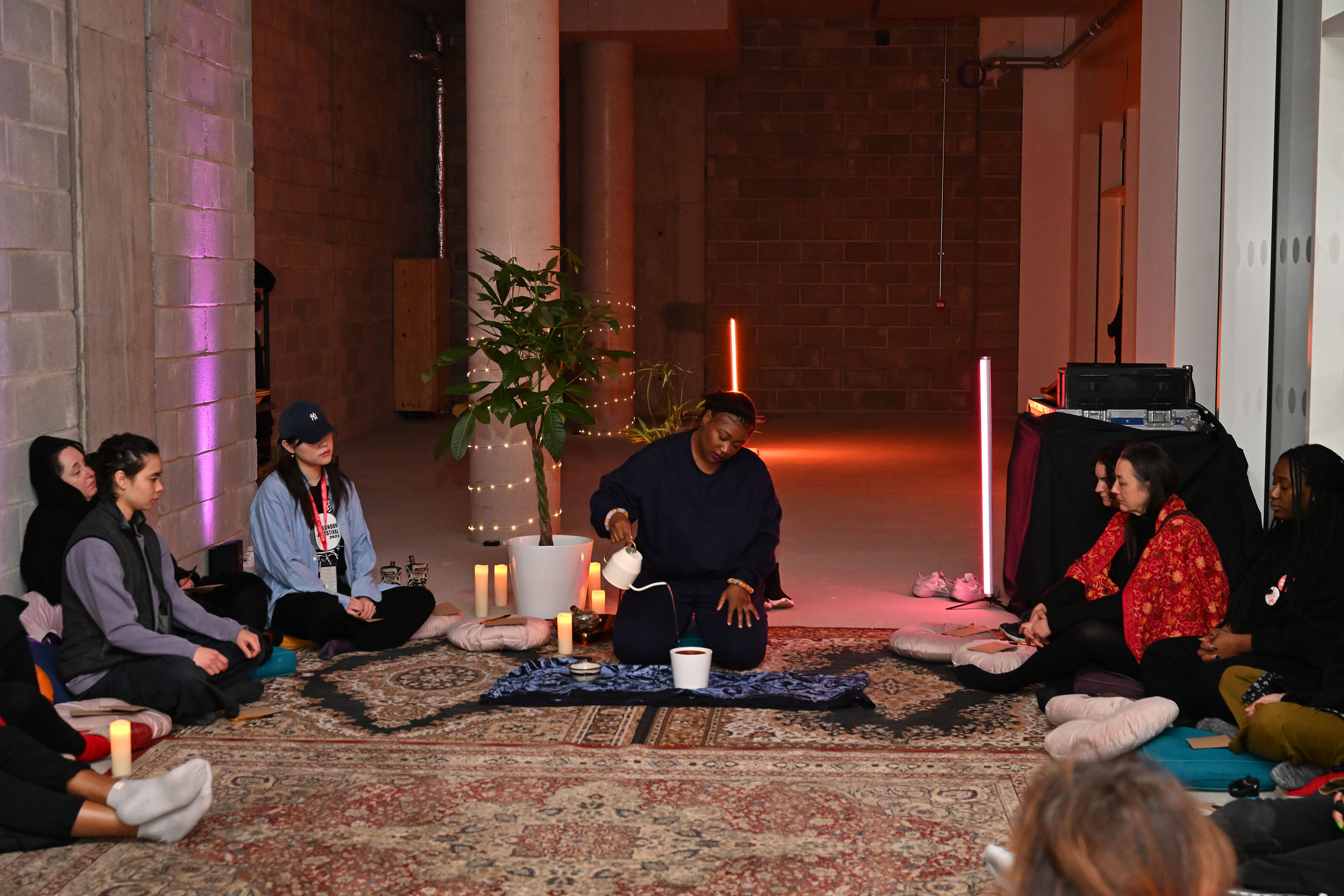 Graphic representation of Omen's Museum logo repeated in red and peach colour.