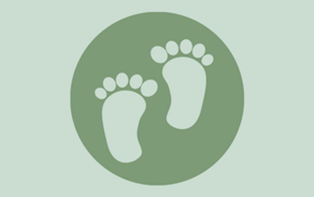 white footprints on green circle