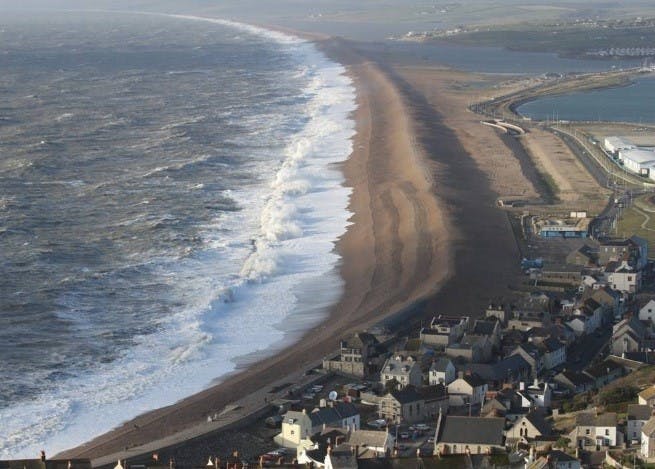 The managed section of Chesil beach from Chesil Cove to the visitor centre, with wave overtopping in Feb 2014