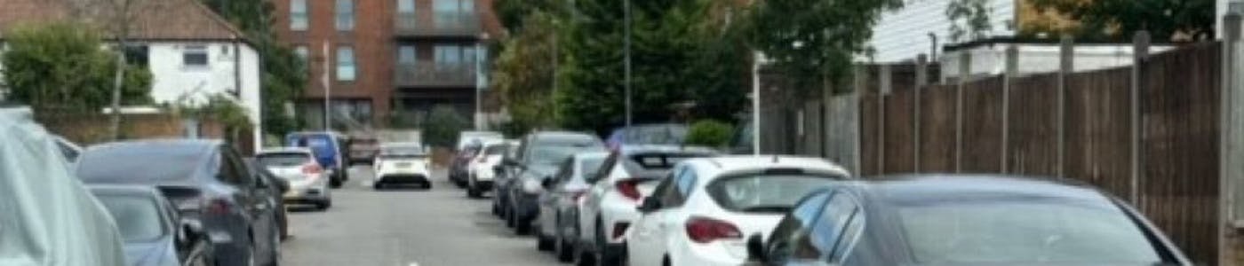 Street with parked cars with Headstone Drive and Harrow View Area