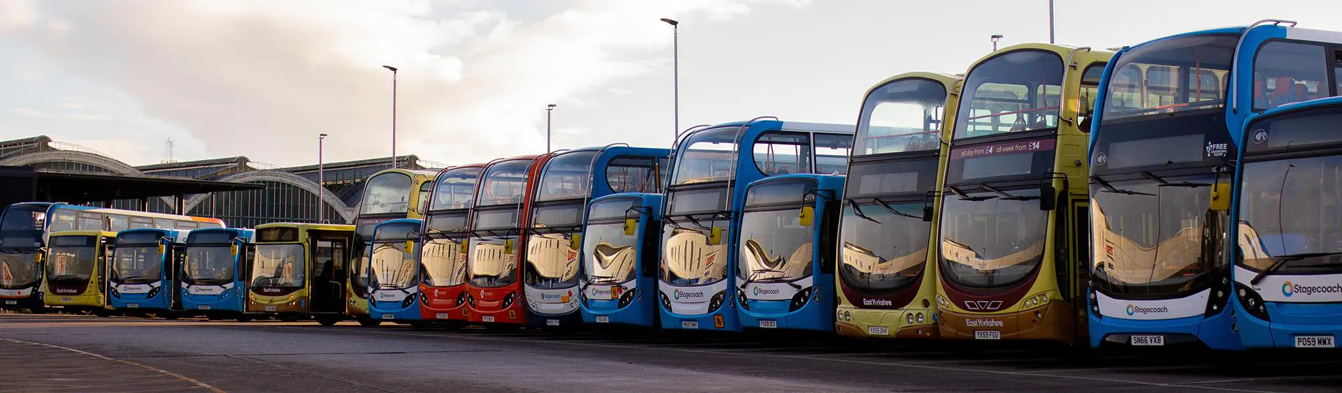 A row of buses parked up