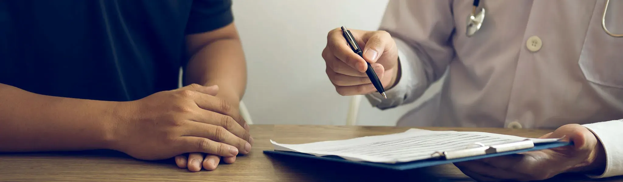 an image of a person writing with another person