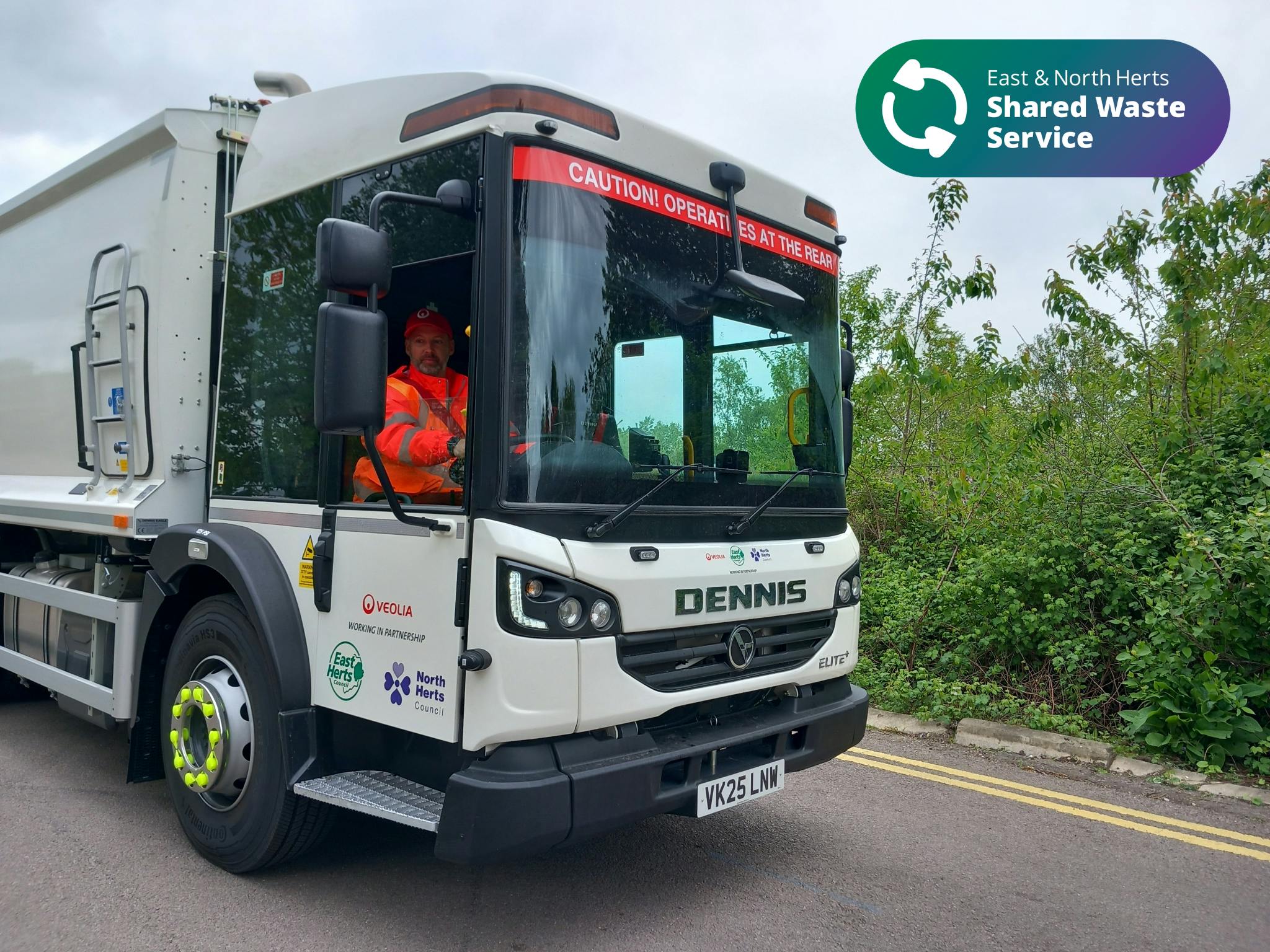 Veolia collection vehicle, driver can be seen wearing orange high visibility clothing 
