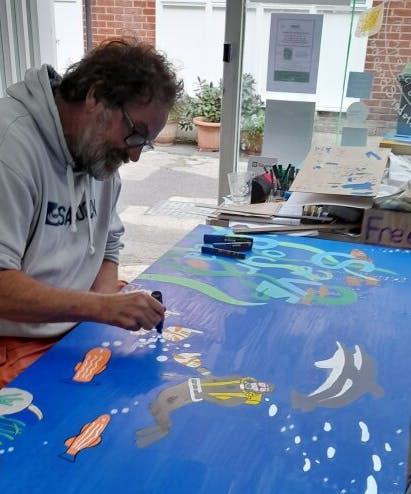 Artist Andy Knill at work