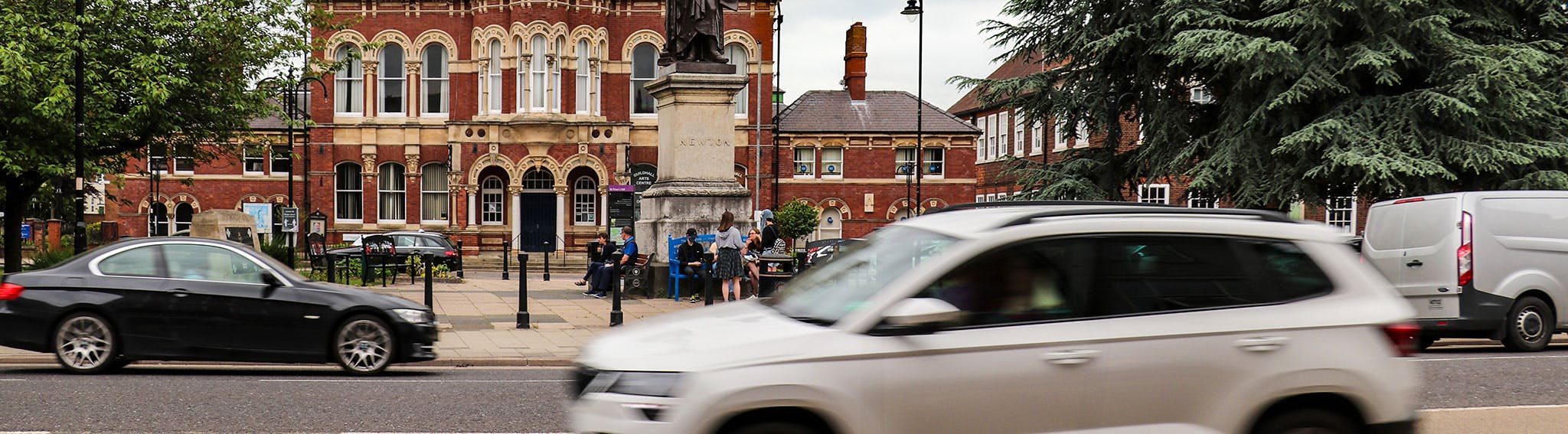 Street scene in the centre of Grantham with cars and people