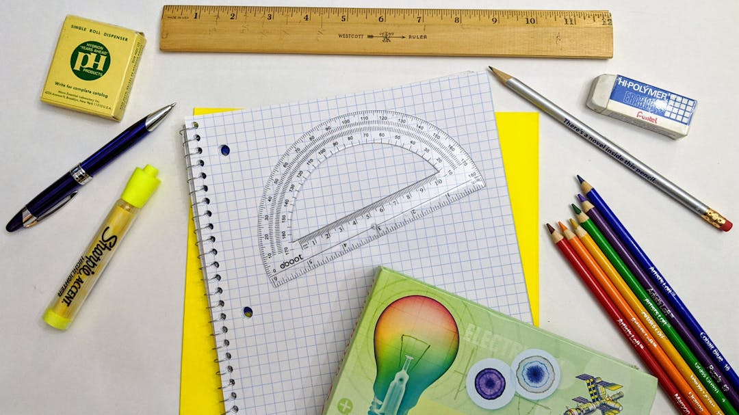 Image shows pencils and mathematical instruments