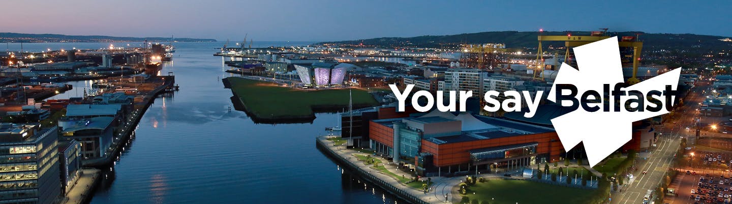 Photo of Belfast Harbour looking towards the Titanic Quarter with Your Say Belfast logo (a starburst shape based on Belfast)