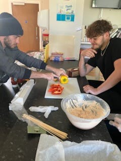 Chicken skewers cooking