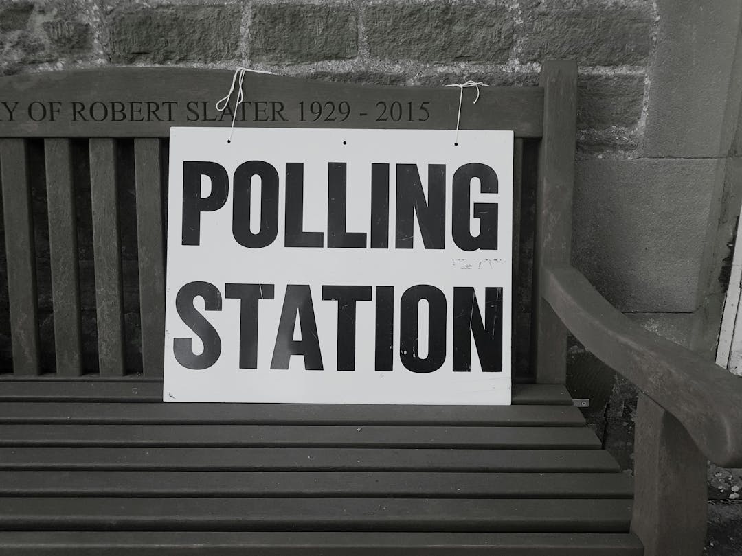 A sign pointing to a polling station