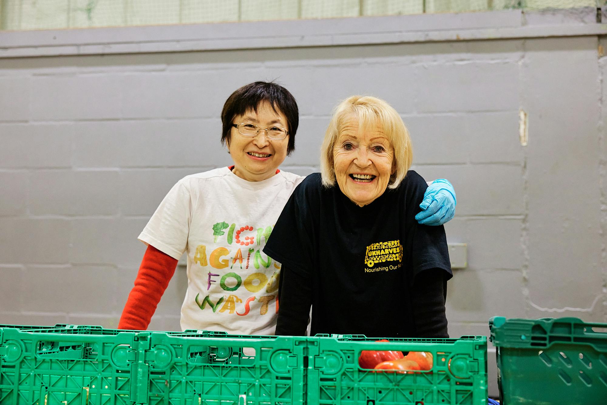 Two people at a Community Food Hub