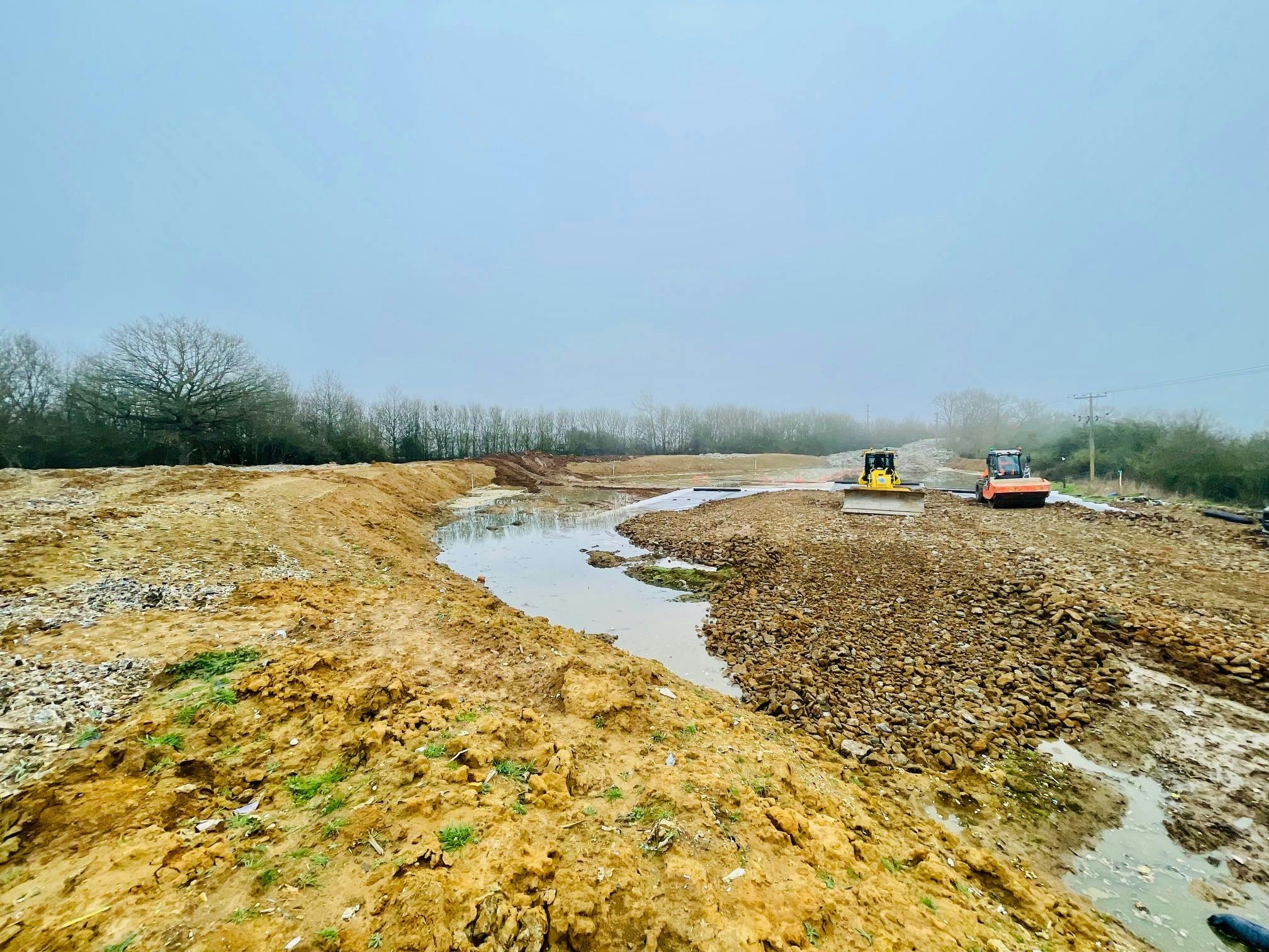 Site preparation March 2026: Aggregate being spread on site on top of geotextile