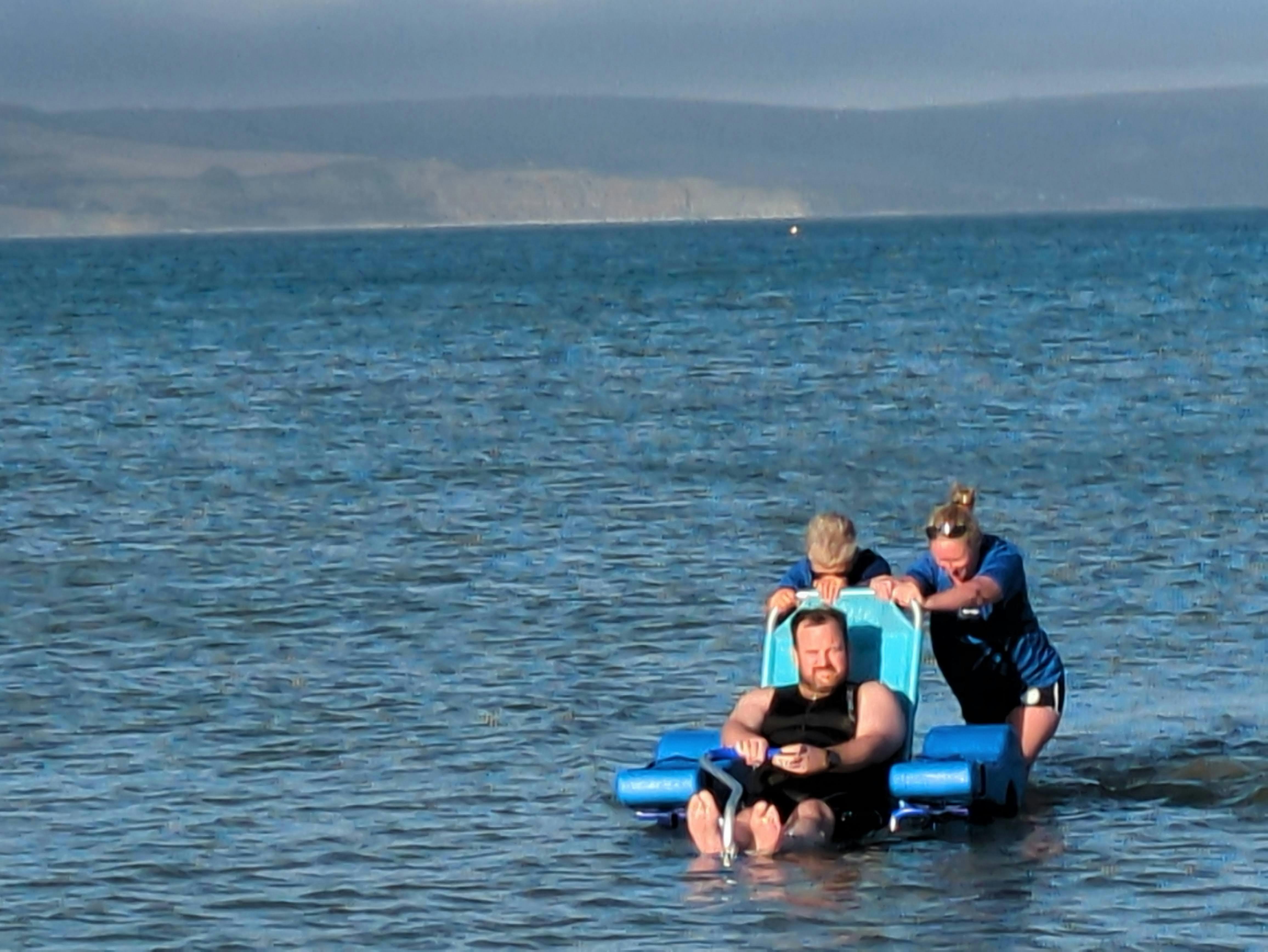 Weymouth Surf Live Saving Club testing amphibious chair on in sea at Weymouth Beach (Credit Weymouth SLSC)