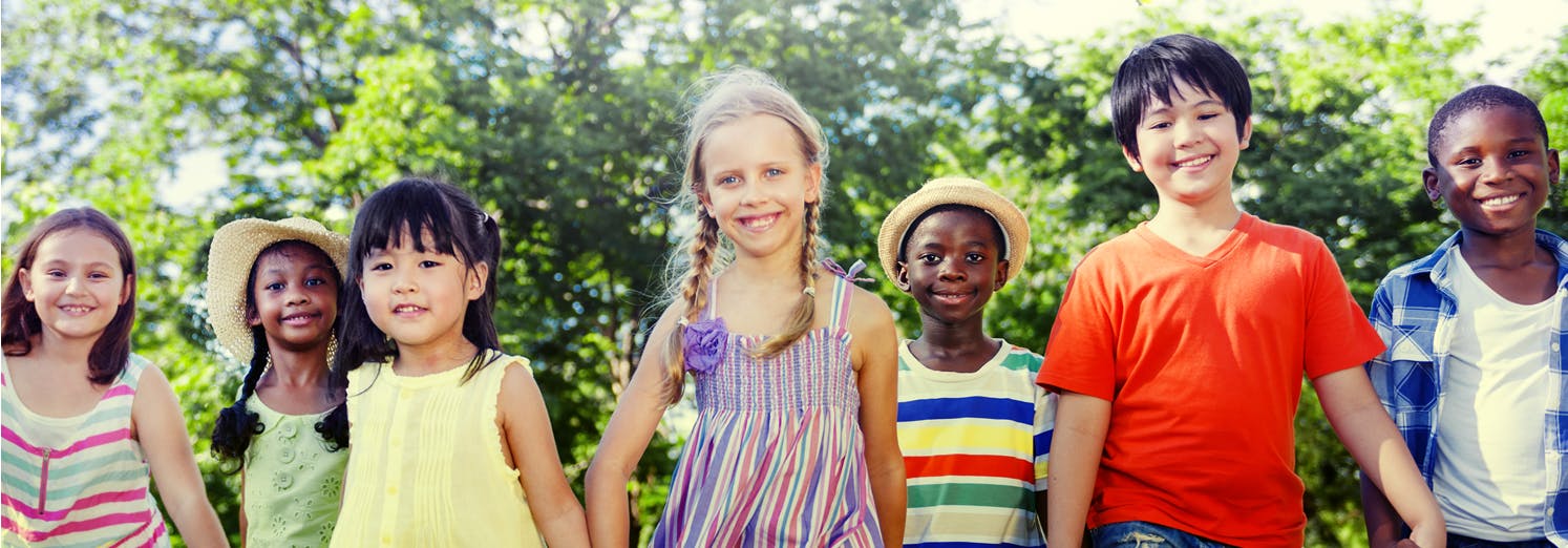 Banner of a group  seven young children walking along holding hands