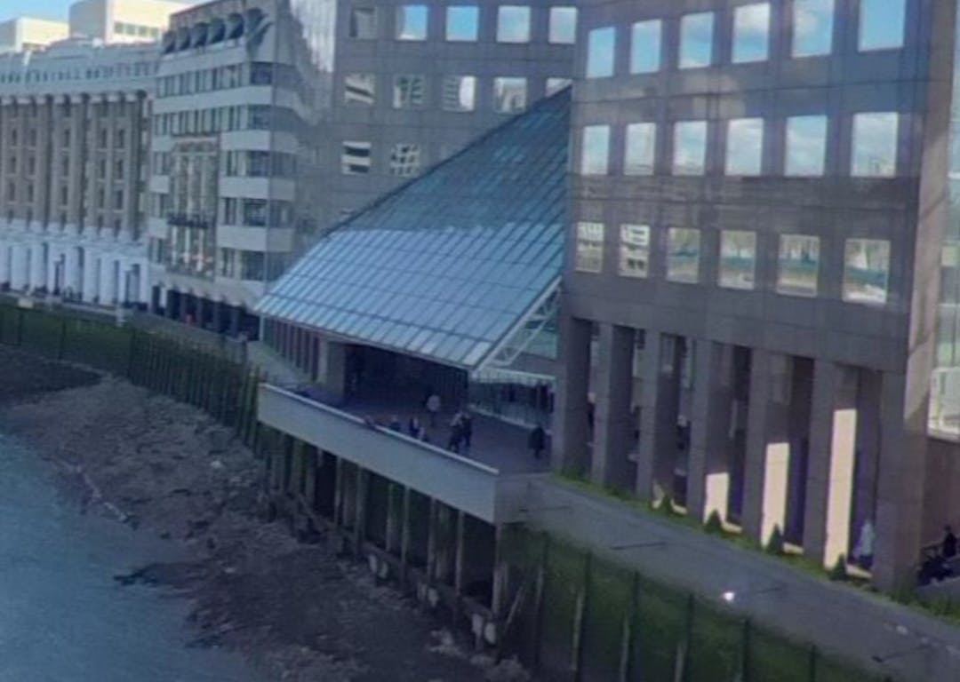 This image is of London Bridge where the steeply pitched glazed roof drains directly over the tidal defence into the river Thames.