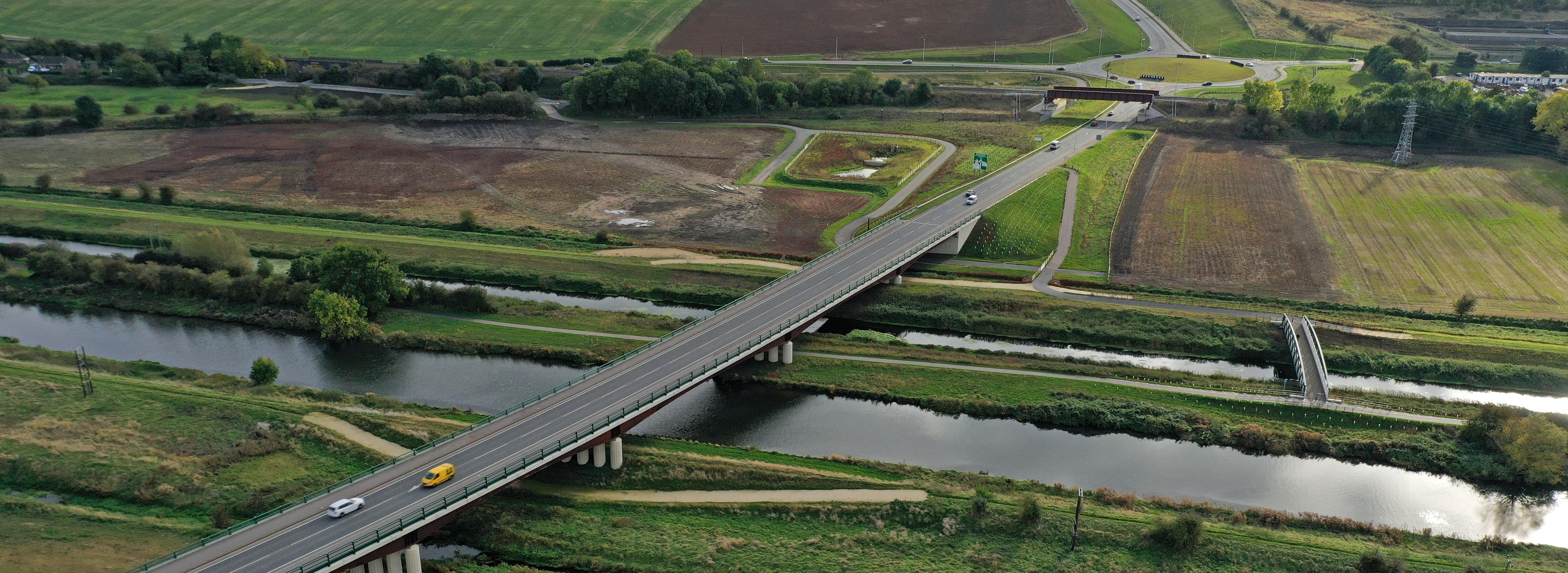 An aerial photograph of part of the Lincoln Eastern Bypass showing a bypass bridge crossing over a river