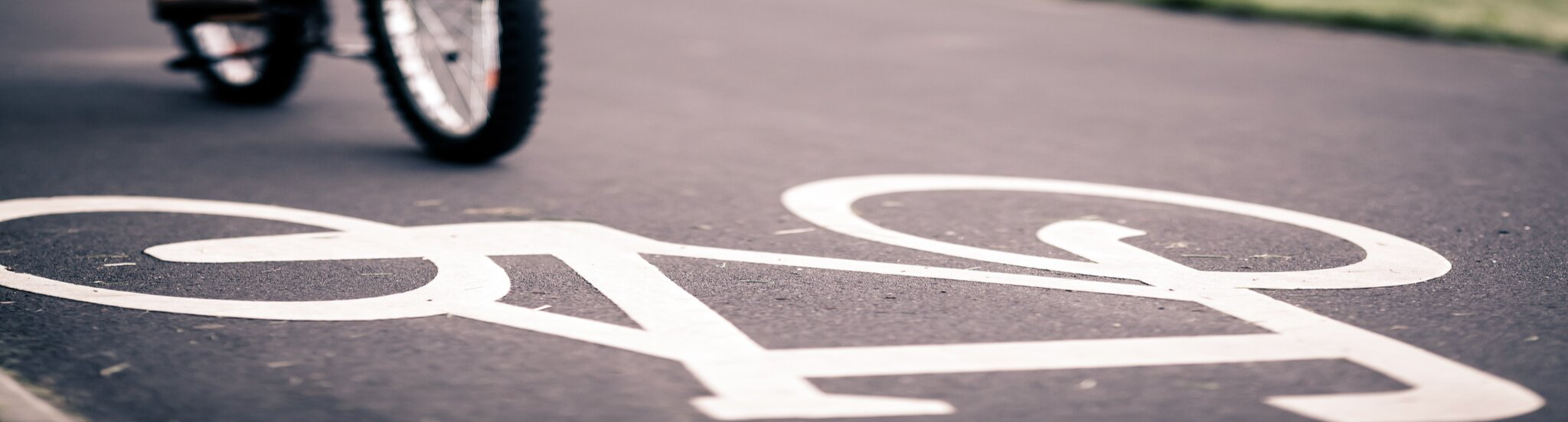 An Image of bike painted in white on the road